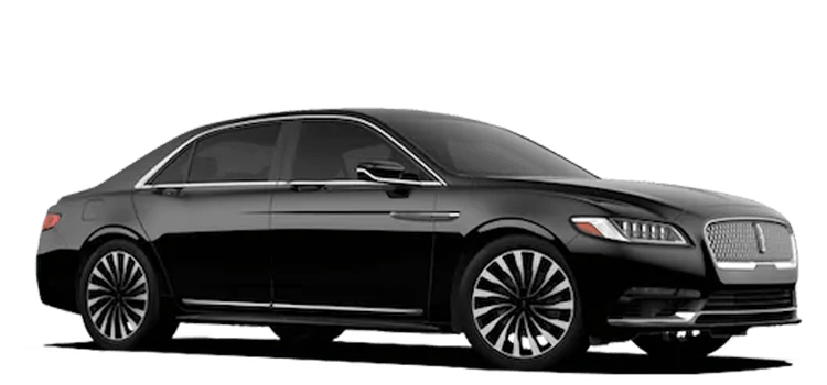 A black luxury sedan with chrome accents, featuring a sleek design and large alloy wheels, viewed from the side.